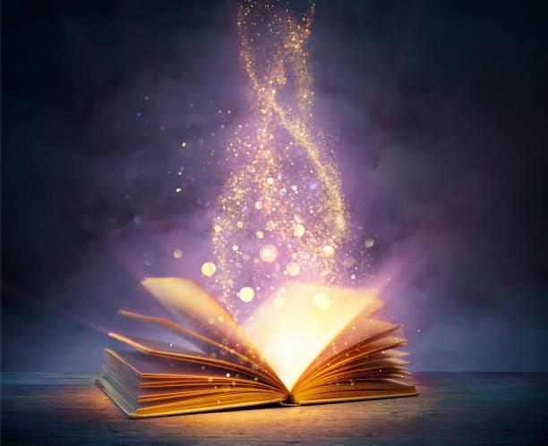 Livre magique avec des pages ouvertes et des lumieres abstraites qui brillent dans les